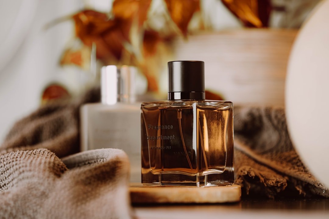 a-bottle-of-perfume-sitting-on-top-of-a-table-ufuchdzawng