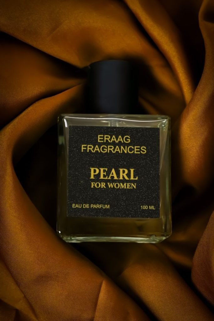 Elegant Eau de Parfum for women by Eraag Fragrances on rich satin fabric.