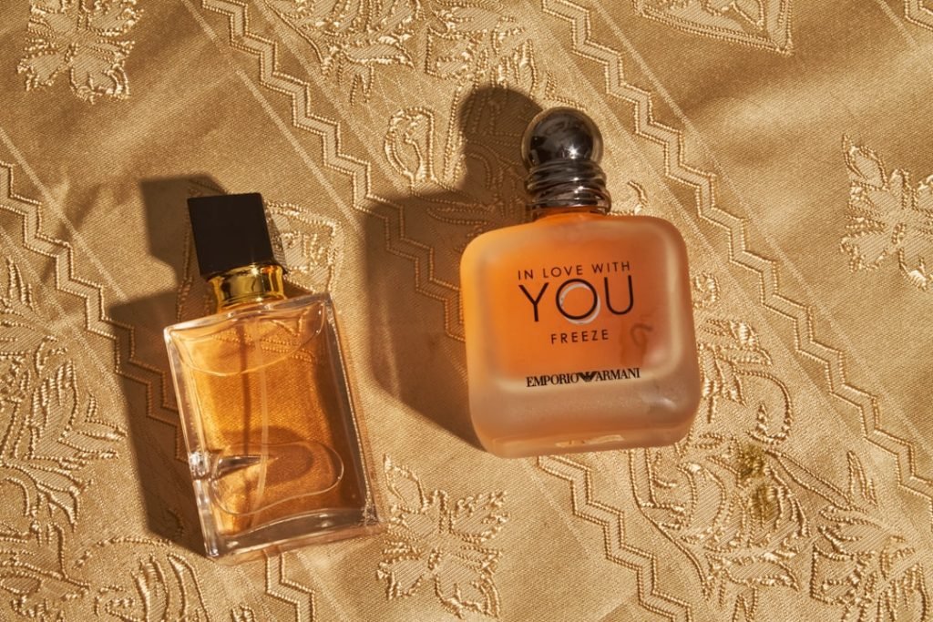 About two-perfume-bottles-on-a-golden-patterned-fabric-06flxvcskwy